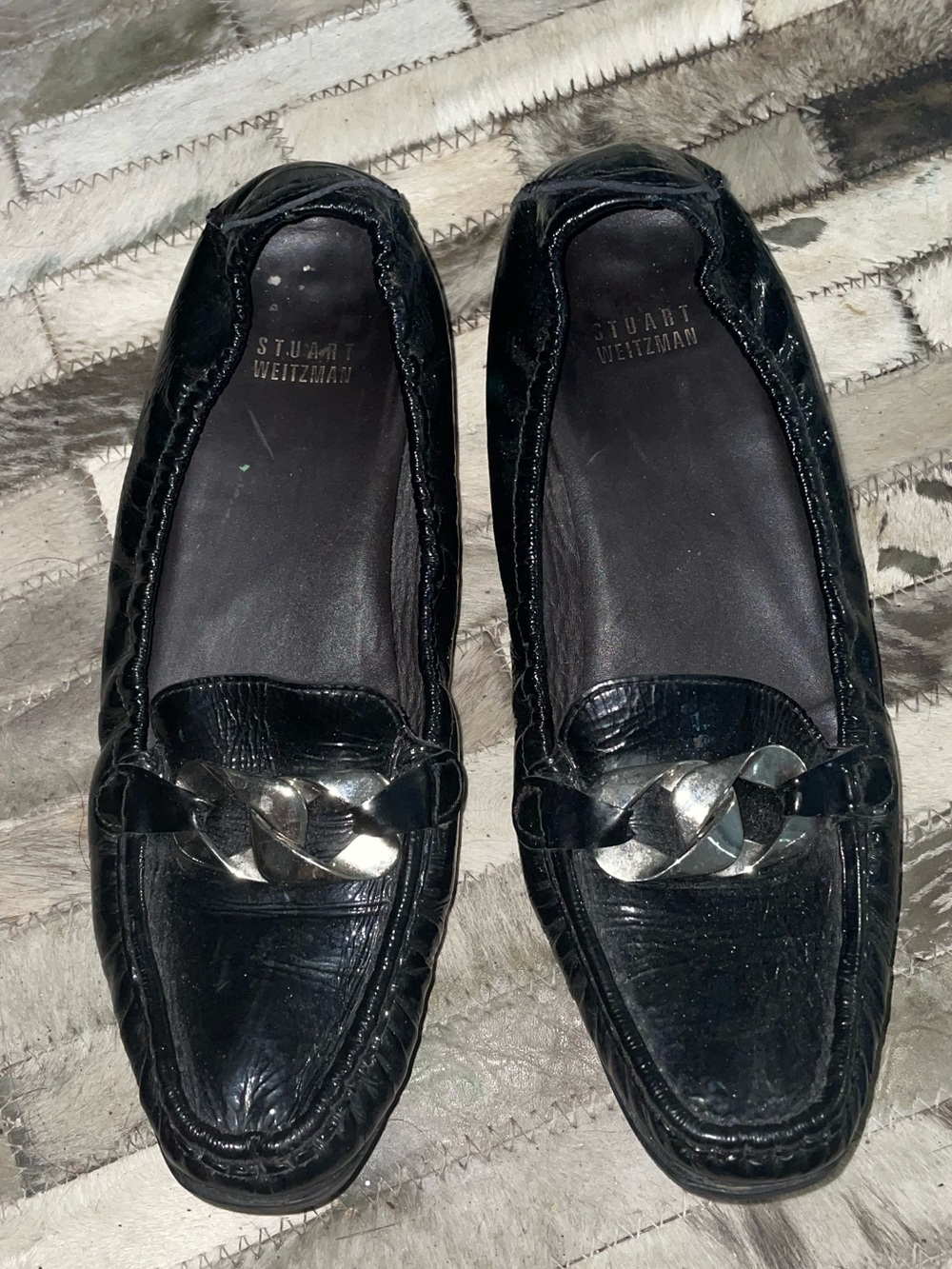 Stuart Weitzman Black Leather Loafers with Silver Chain Detail